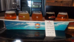 Rip Current Brewing Photos  - Surfboard Flight / Full bar and can collection