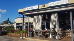 Mastry's Brewing St Pete Beach Image of  Fonrt / Image of Larry, Mitzie and Tito 
